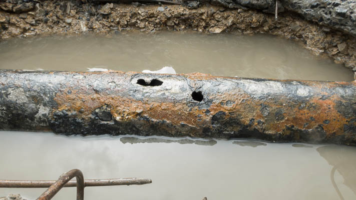 Corroded pipe leaking under a slab in Tulsa